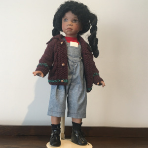 18-inch modern black Rudy doll with twisted pigtails, adorable brown sweater and denim overalls