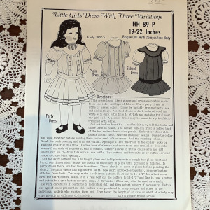 Sewing pattern to make short, drop-waisted children's dresses for 19 to 22-inch dolls
