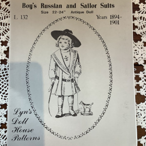 Pattern for a knee-length boys' dress with a sailor collar extending to the waist
