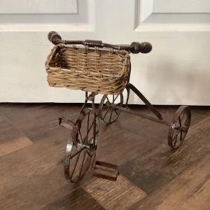 Black painted tricycle with unpainted wicker basket