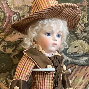 White-haired doll in brown suit with matching hat and short skirt