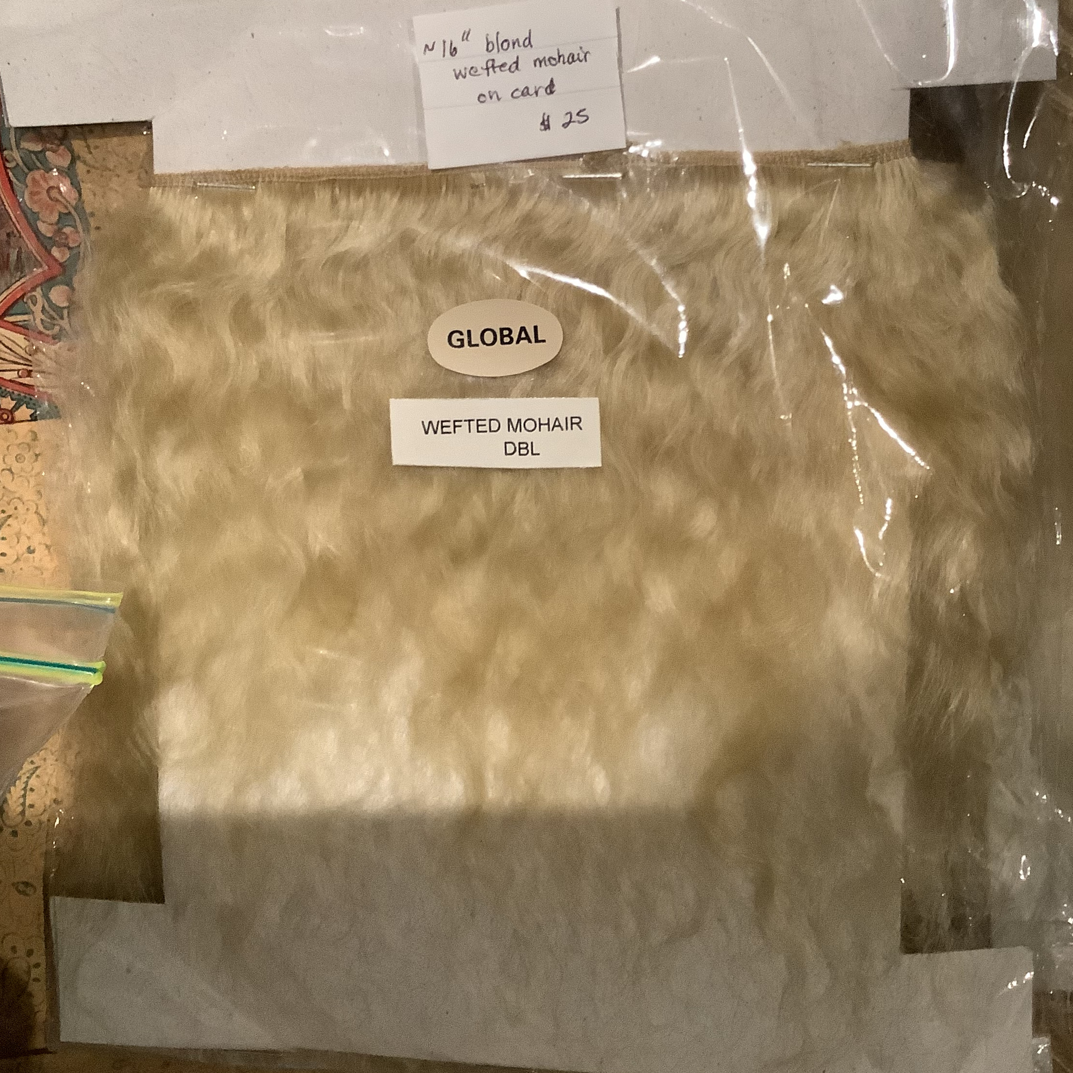 A card of wefted mohair dyed light blond