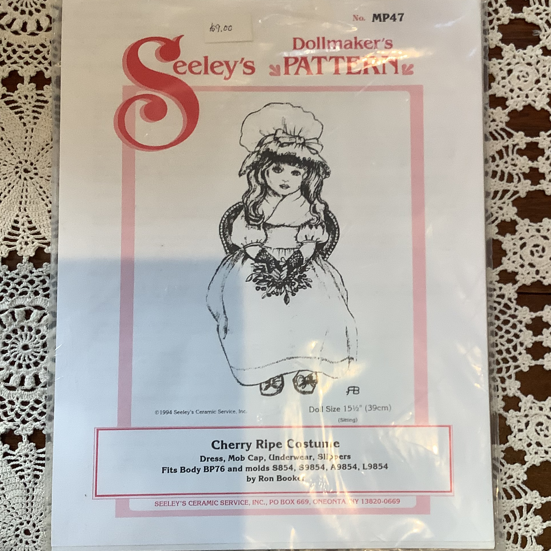 Sewing pattern to make a dress, cap, underwear and slippers for a 15 and a half inch doll