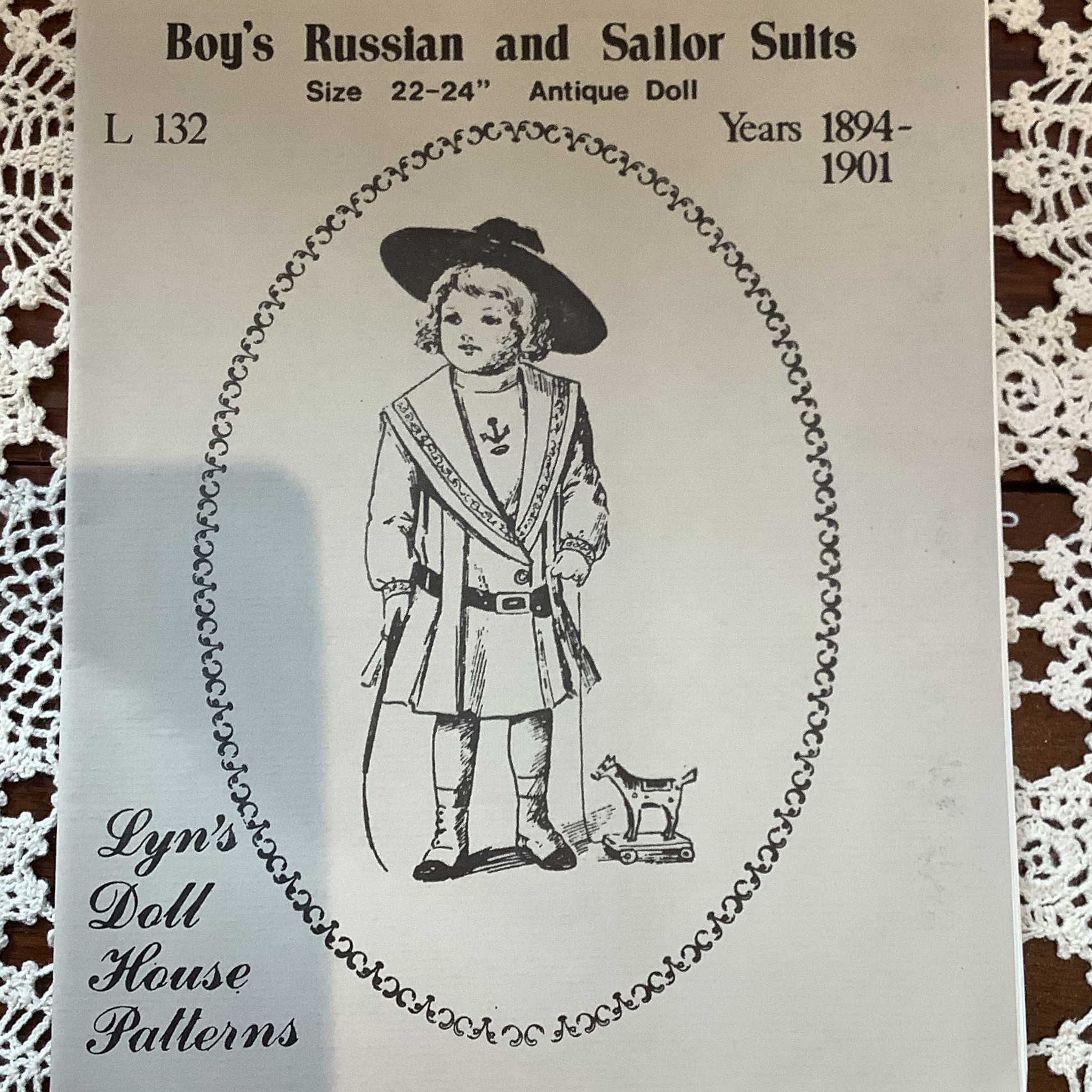 Pattern for a knee-length boys' dress with a sailor collar extending to the waist
