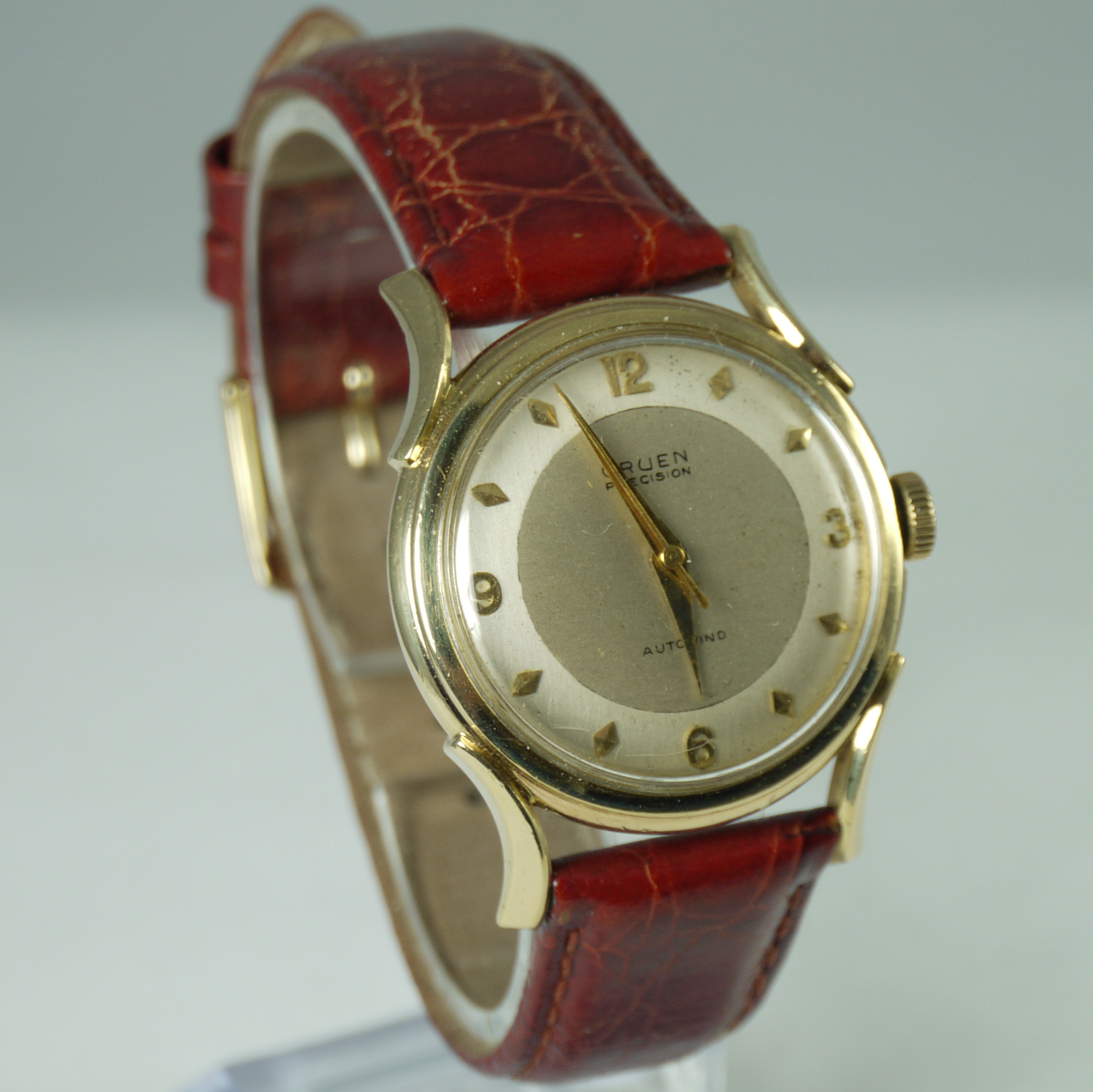  Gruen Precision automatic wristwatch in 14 karat yellow
                                        gold with brown leather band